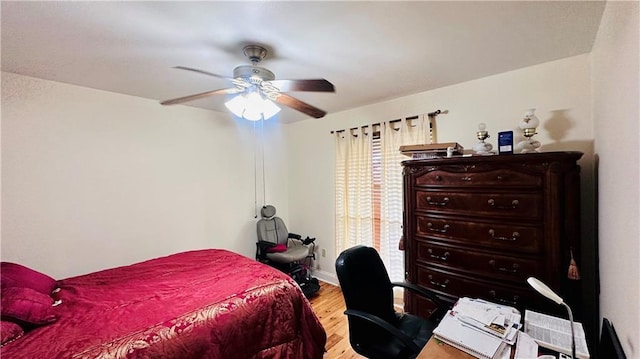 bedroom featuring ceiling fan and light hardwood / wood-style floors