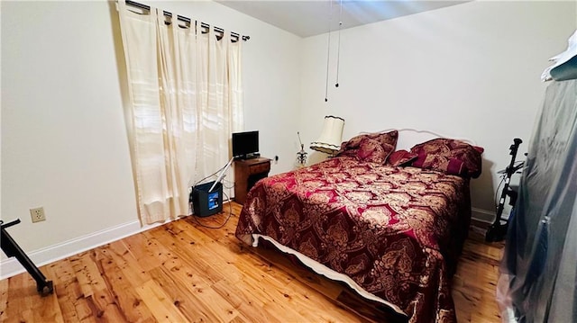 bedroom featuring wood-type flooring