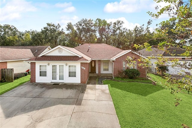 ranch-style house featuring french doors and a front yard