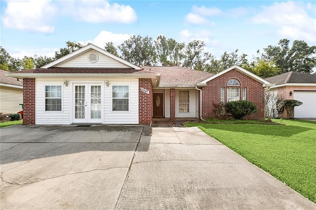 ranch-style home with a front yard and french doors