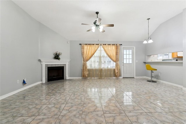 unfurnished living room featuring ceiling fan, lofted ceiling, and a tiled fireplace