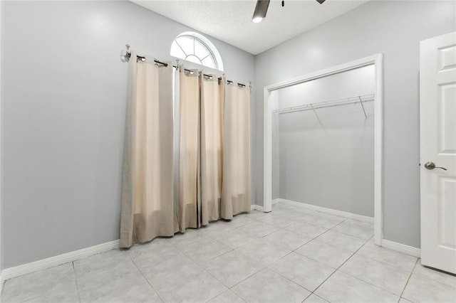 bathroom with tile patterned flooring and ceiling fan