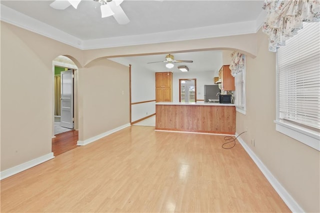 interior space with ceiling fan and light hardwood / wood-style floors