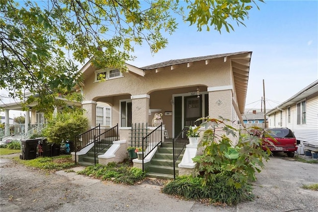 50507 Passera Ct, New Orleans, LA 70119 - view of front of home with stucco siding and covered porch