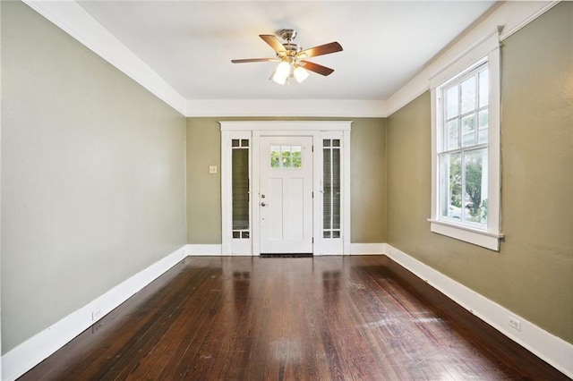 foyer with dark hardwood / wood-style flooring, a wealth of natural light, and ceiling fan