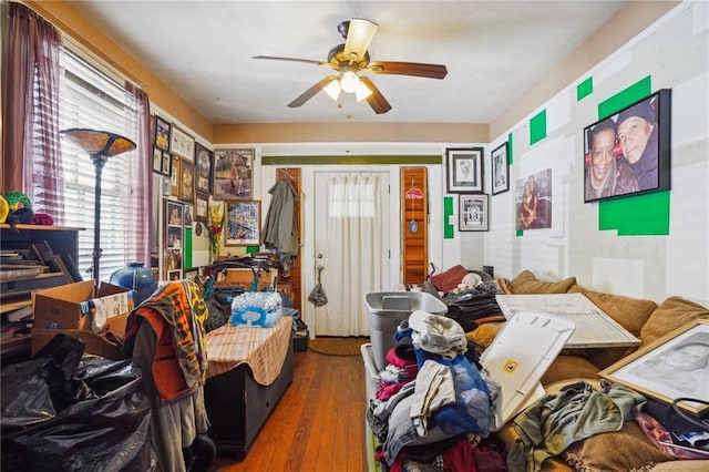 interior space with ceiling fan and hardwood / wood-style floors