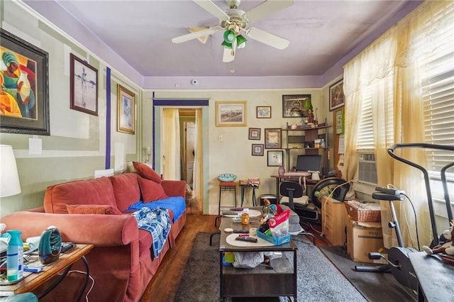 living room with ceiling fan, cooling unit, and dark wood-type flooring