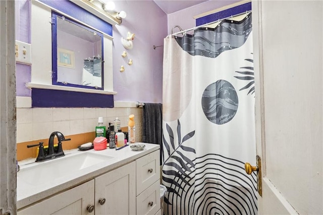 50507 Passera Ct, New Orleans, LA 70119 - full bathroom featuring vanity, shower / bath combo with shower curtain, and tile walls
