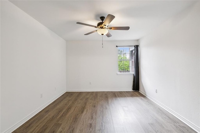 spare room featuring ceiling fan and hardwood / wood-style flooring