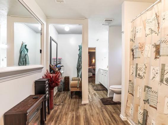 corridor featuring hardwood / wood-style floors