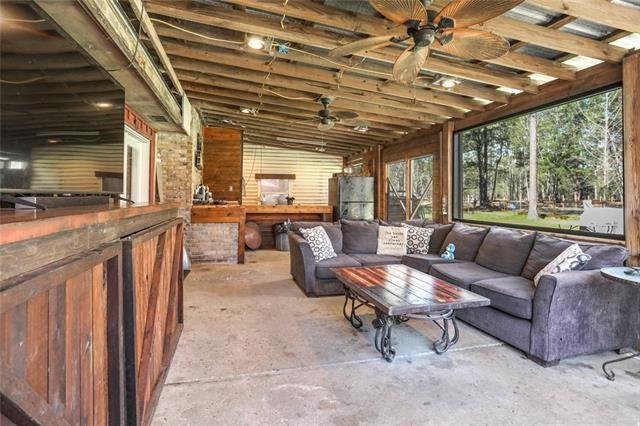 interior space with ceiling fan