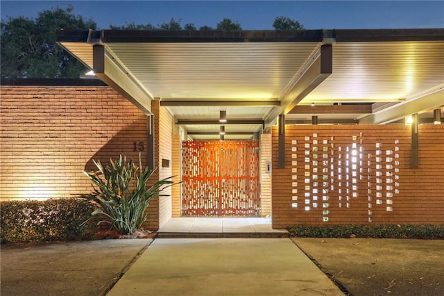 view of exterior entry at night