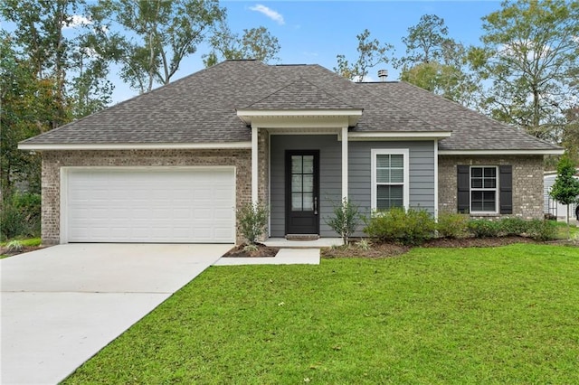 view of front facade with a front yard and a garage