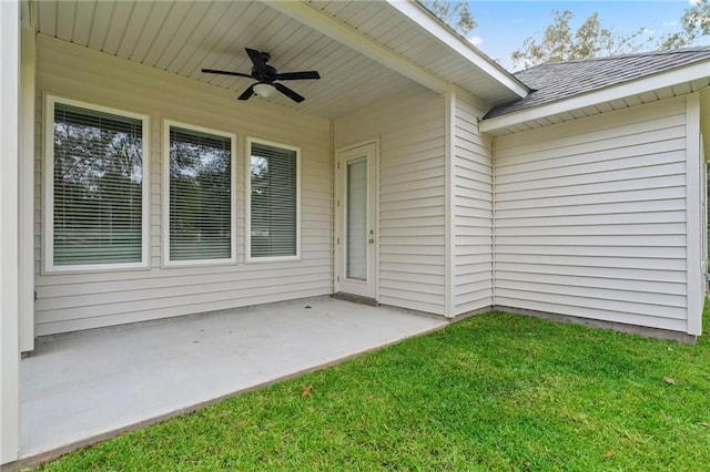 exterior space with ceiling fan