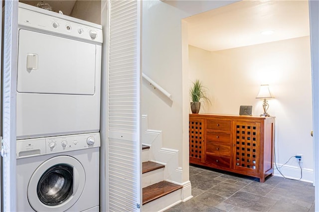 laundry room with stacked washing maching and dryer