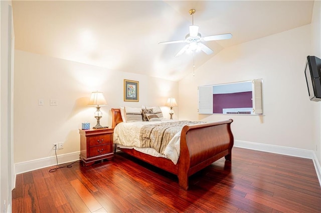 bedroom featuring vaulted ceiling, ceiling fan, and dark hardwood / wood-style floors