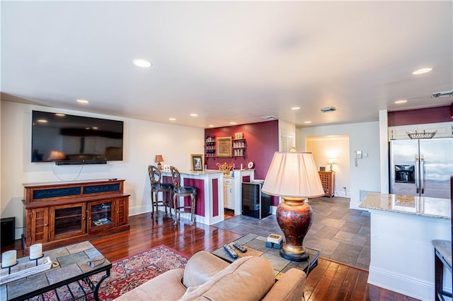 living room featuring dark hardwood / wood-style flooring