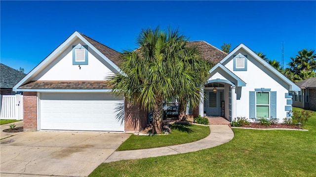 view of front of house with a front yard and a garage