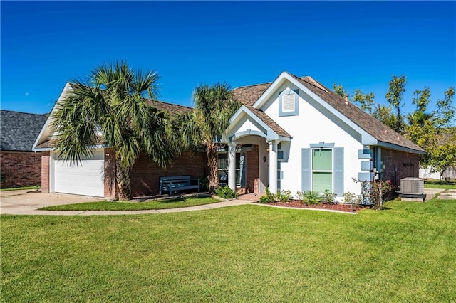 view of front of home featuring cooling unit, a garage, and a front yard