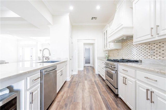 kitchen featuring white cabinets, dark hardwood / wood-style flooring, sink, and stainless steel appliances