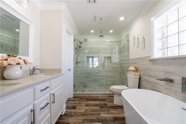 full bathroom featuring vanity, shower with separate bathtub, crown molding, tile walls, and hardwood / wood-style floors