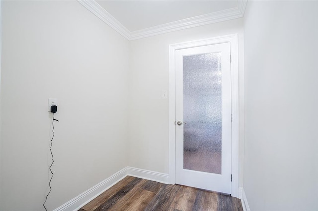 entryway with dark hardwood / wood-style flooring and crown molding