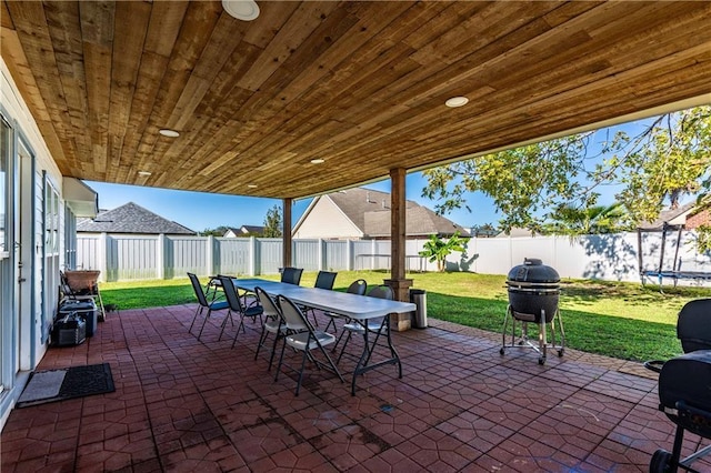 view of patio / terrace featuring a trampoline and a grill