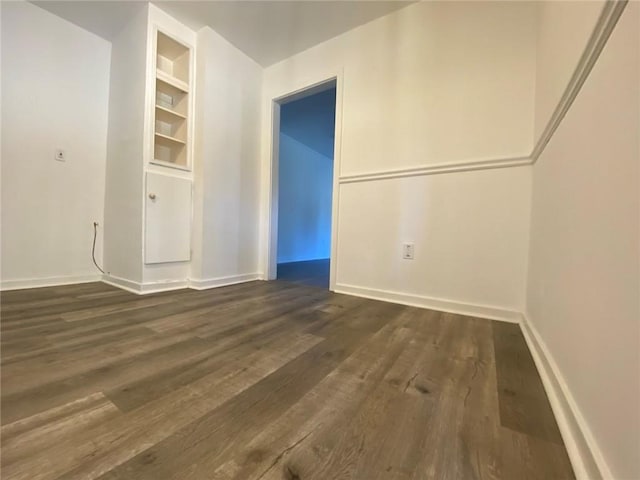 empty room with dark wood-type flooring