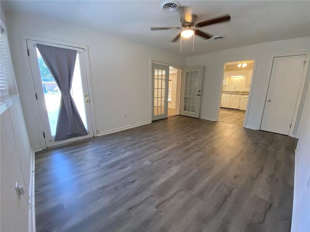 interior space featuring wood-type flooring, french doors, and ceiling fan