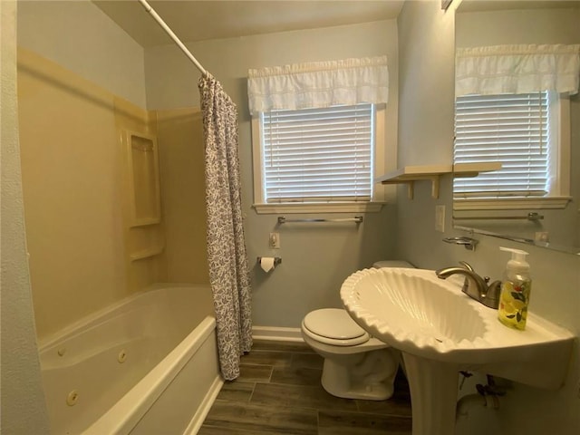 350 Carolyn Dr, Harahan, LA 70123 - full bathroom featuring wood finished floors and a combined bath / shower with jetted tub