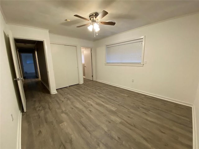 350 Carolyn Dr, Harahan, LA 70123 - unfurnished bedroom with dark wood-type flooring, a closet, ceiling fan, and crown molding