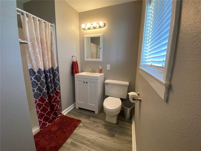 350 Carolyn Dr, Harahan, LA 70123 - full bath with wood finished floors, vanity, and curtained shower