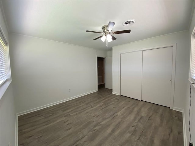 350 Carolyn Dr, Harahan, LA 70123 - unfurnished bedroom with wood finished floors, a closet, and ceiling fan