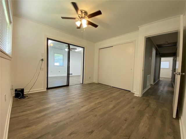 350 Carolyn Dr, Harahan, LA 70123 - unfurnished bedroom with dark wood-style flooring and a ceiling fan