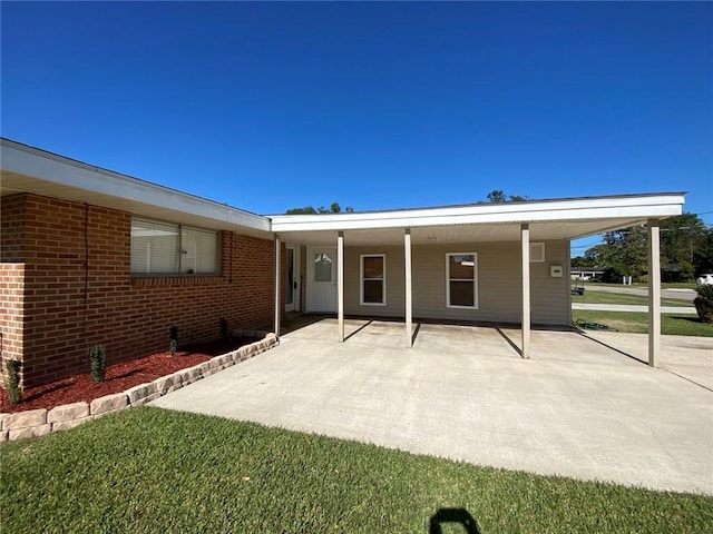 350 Carolyn Dr, Harahan, LA 70123 - rear view of property with a carport and brick siding