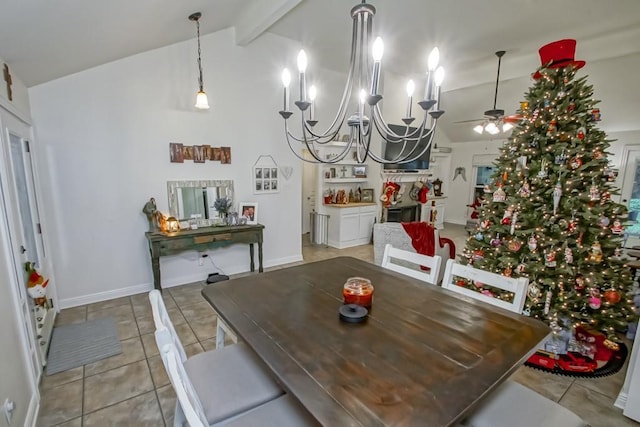 tiled dining space featuring vaulted ceiling with beams and ceiling fan with notable chandelier