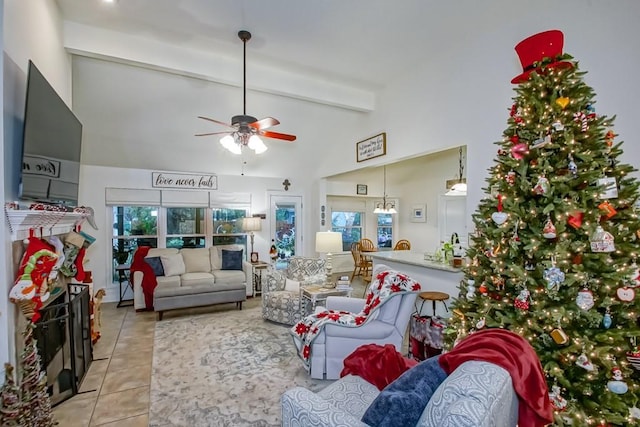 tiled living room featuring beam ceiling, ceiling fan, and high vaulted ceiling