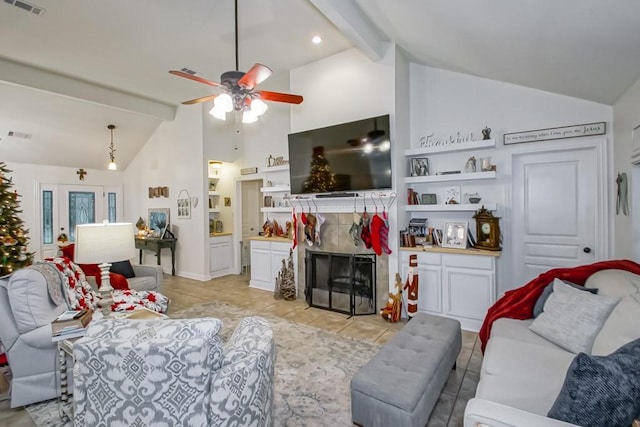 tiled living room with ceiling fan, beam ceiling, high vaulted ceiling, and a tiled fireplace