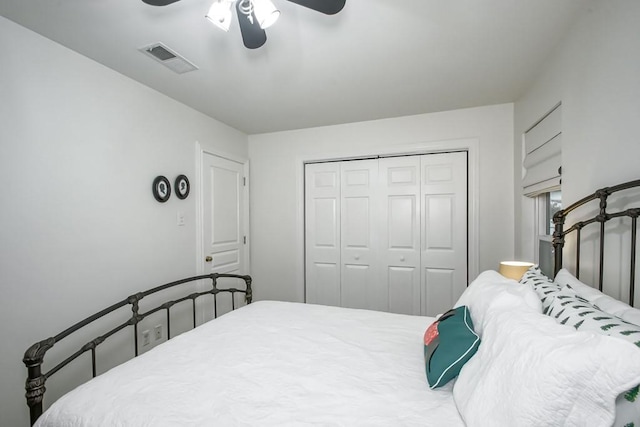 bedroom featuring ceiling fan and a closet