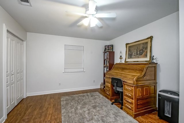 office space with ceiling fan and dark wood-type flooring