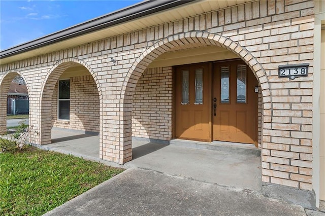 doorway to property with a porch