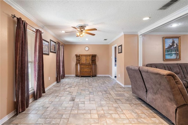 living room with ceiling fan, ornamental molding, and a textured ceiling