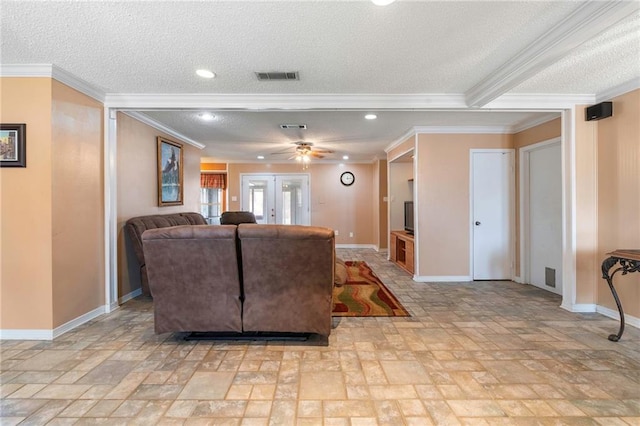 living room featuring a textured ceiling, ceiling fan, crown molding, and french doors