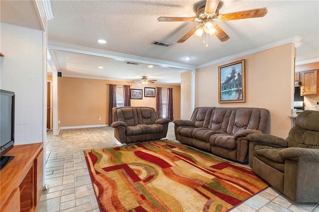 living room with ceiling fan, a textured ceiling, and ornamental molding