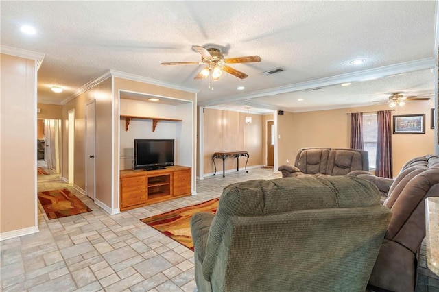 living room featuring a textured ceiling, ceiling fan, and crown molding