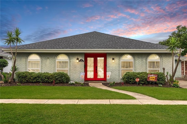 ranch-style house with a yard