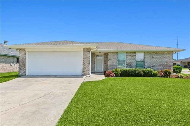 20 Cocodrie Ct, Kenner, LA 70065 - single story home with brick siding, a garage, a front lawn, and driveway