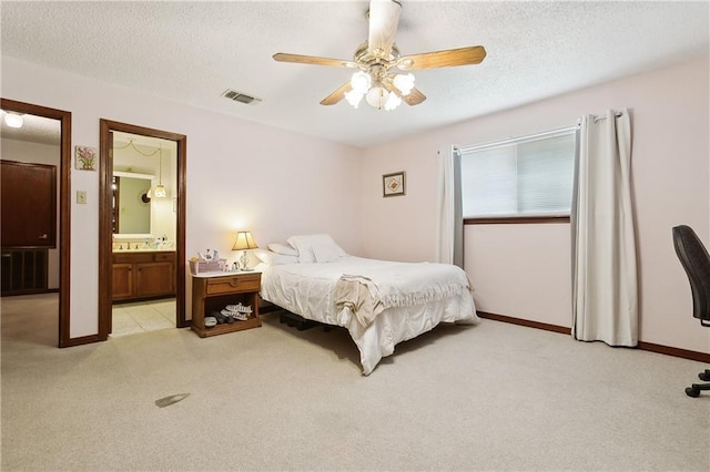 20 Cocodrie Ct, Kenner, LA 70065 - bedroom featuring ceiling fan, light colored carpet, a textured ceiling, baseboards, and visible vents