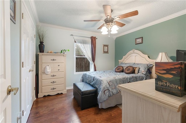 bedroom featuring a textured ceiling, dark hardwood / wood-style flooring, ceiling fan, and ornamental molding