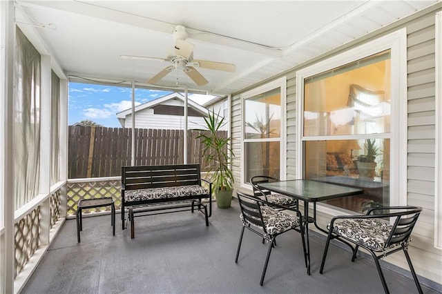 sunroom featuring ceiling fan